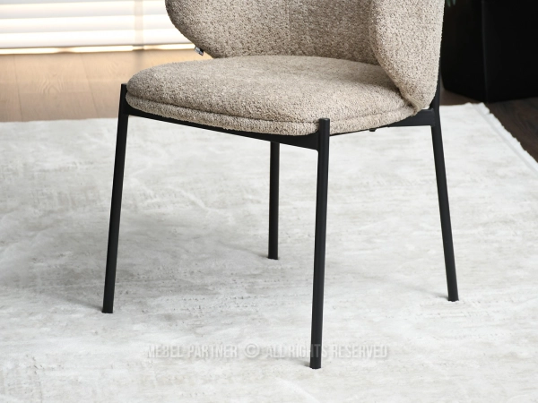 Krzesło tapicerowane tkaniną boucle, które musisz mieć 
